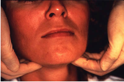 doctor palpating lymph nodes under jaw. 