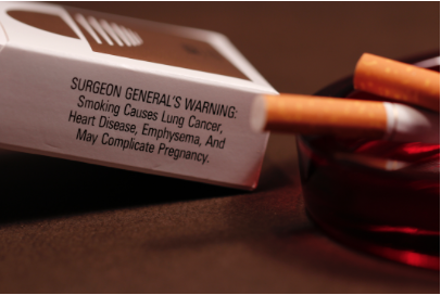 cigarette warning label on the box with cigarettes in the box. 