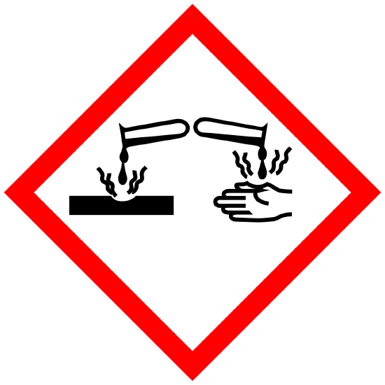 is a sign containing the symbol for corrosion hazard
