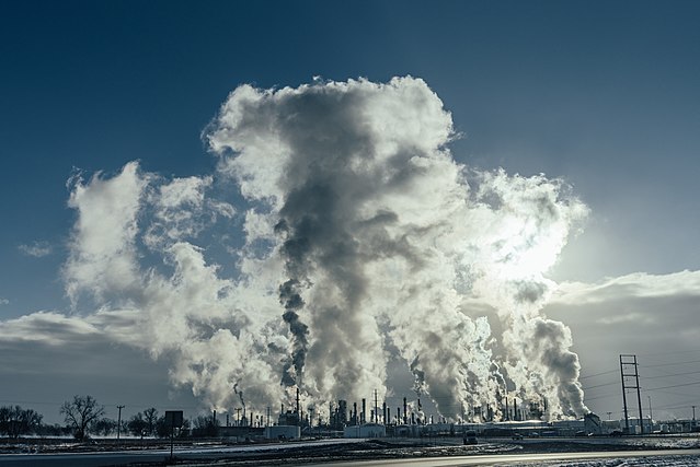 An oil refinery in Minnesota releases plumes of smoke.