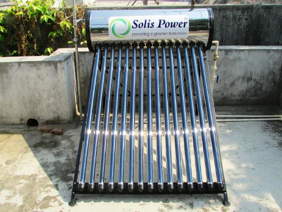 A solar water heater has a cylindrical tank on top and rows of tubes running diagonal to it.