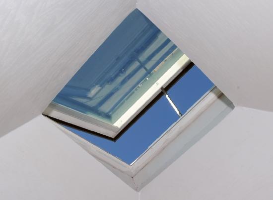 A skylight appears like a slightly open window in the ceiling