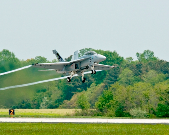 A Navy fighter jet called "Green Hornet" takes flight