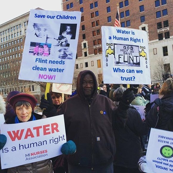 Flint residents trying to bring awareness of Flint Water Crisis through peaceful demonstration.